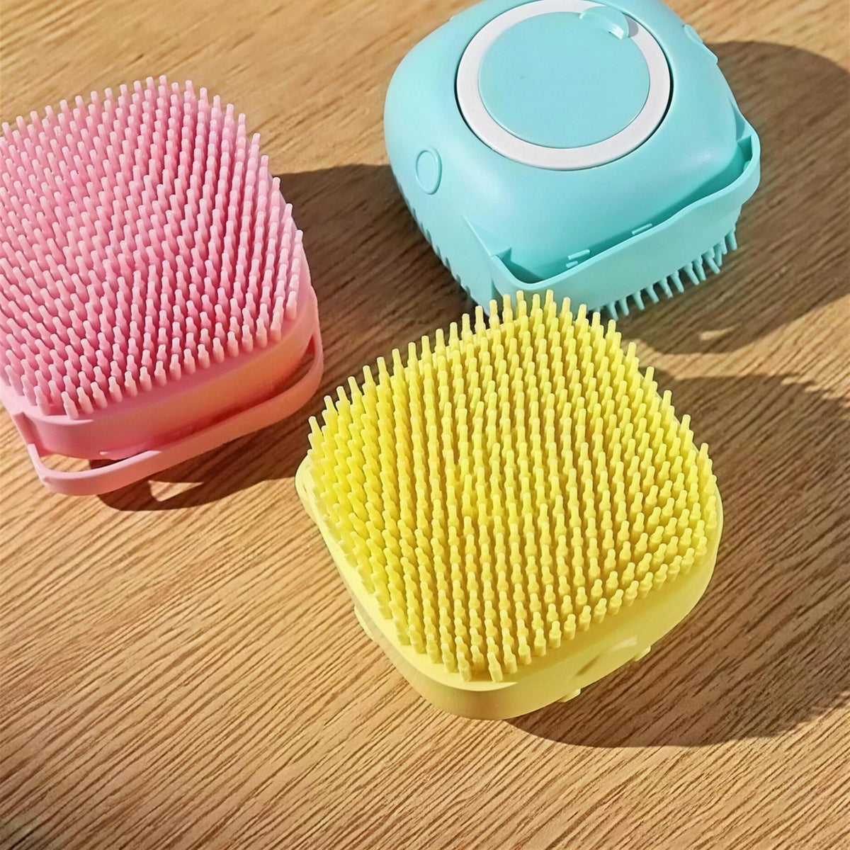 Pet Wash Brush in pink, blue and yellow silicone